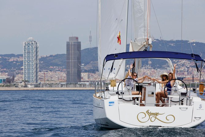1h Refreshing Sailing Tour in Barcelona with Open Bar & Snacks - Onboard comfort: open bar, snacks, cushions, and a professional skipper