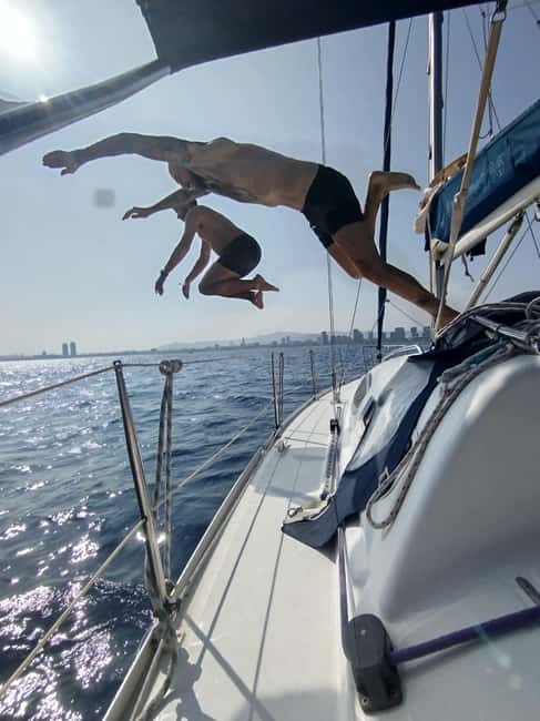 Barcelona Badalona : Sailboat Tour, Snacks, Drinks, Swimming - Skyline observation with binoculars: seeing Barcelona from a new angle