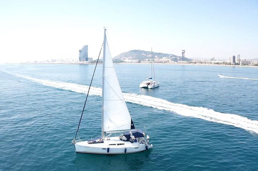 Barcelona: Boat trip with cava in amazing sailboat - Cava, drinks, and your own music on board