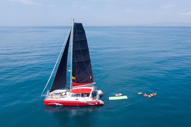 Barcelona Catamaran Cruise with Tapa & Drink Included - The welcome drink and tapa: small, local, and best eaten with expectations