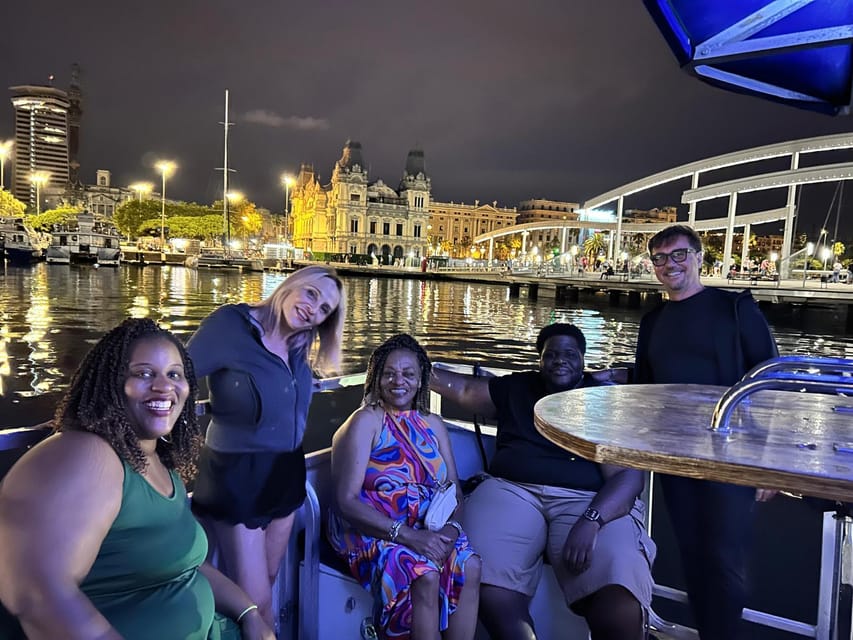 Barcelona: City Views Catamaran Cruise with Music - Watching Port of Barcelona activity from a small craft