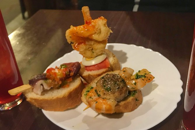 Barcelona Food Tour: Market & Gothic Quarter with Expert Guide - Plaça del Rei, Temple dAugust, and Catalan dessert at a family deli
