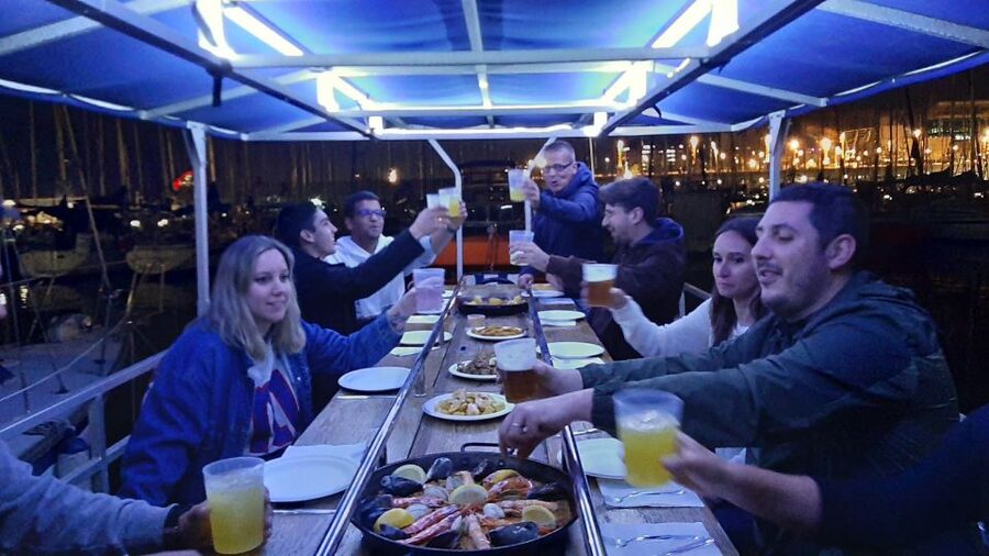 Barcelona: Private Evening Cruise with Dinner and Drinks - The onboard vibe: music, conversation, and city-light views