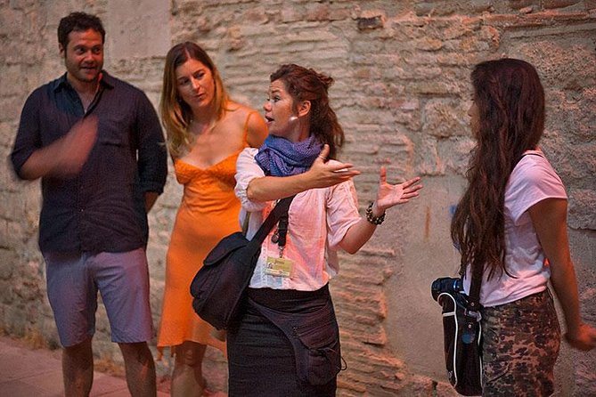 Barcelona's Dark History Night Tour - Props, projector images, and radioguides that keep it clear