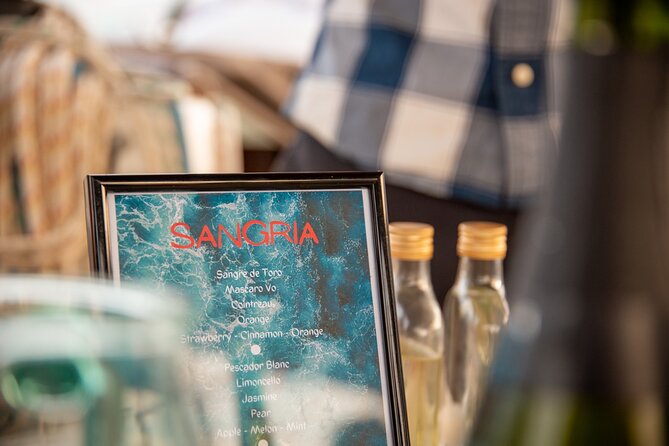 Barcelona Sailing Adventure with Sangria Workshop - Food and drinks onboard: tapas, seafood conserves, and charcuterie