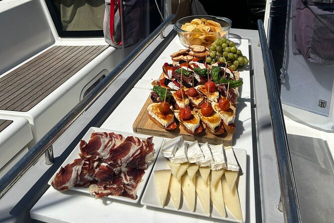 Barcelona: Sailing Tour with Tapas, Drinks, Swim & Sunset Option - Boat comfort, sea-sickness risk, and how to avoid a rough surprise