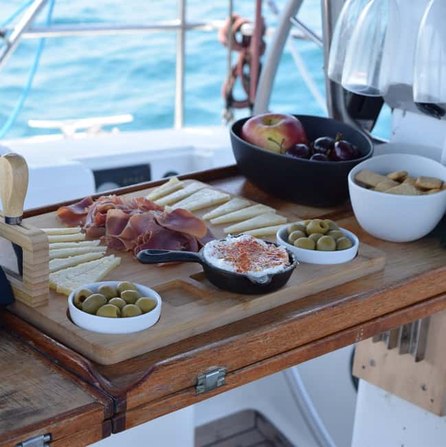 Barcelona: Sailing with Open Bar, Catalan Snack & Swim Stop - Picking morning, afternoon, or sunset for better light and energy