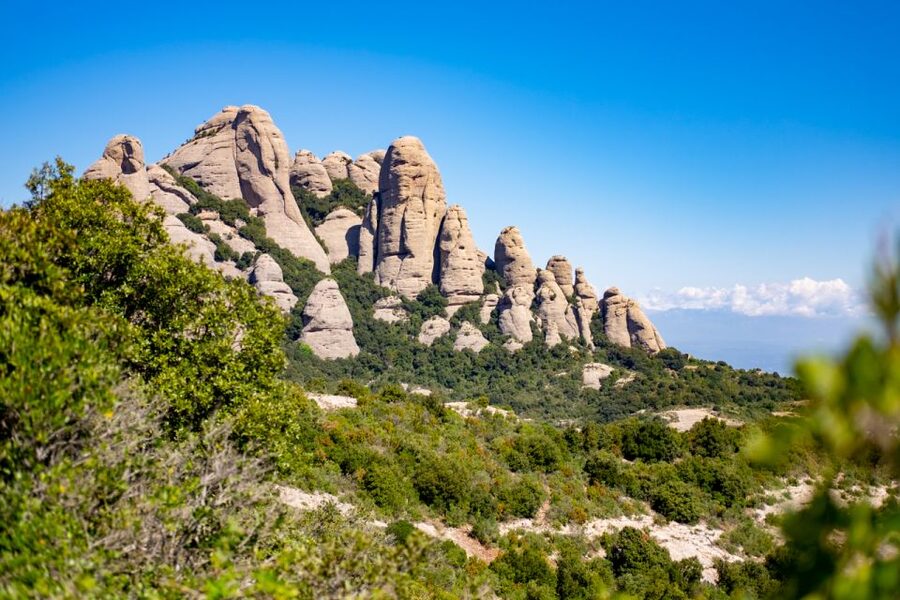 Barcelona: Sitges & Montserrat Monastery Tour with Easy Hike - Montserrat Monastery and St Michael’s cross, the whole point of the day