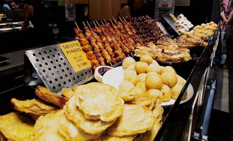 Barcelona: Street Food & Sightseeing Tour with Local Market - What you’ll taste: patatas bravas, jamón, and the rest of the Catalan lineup