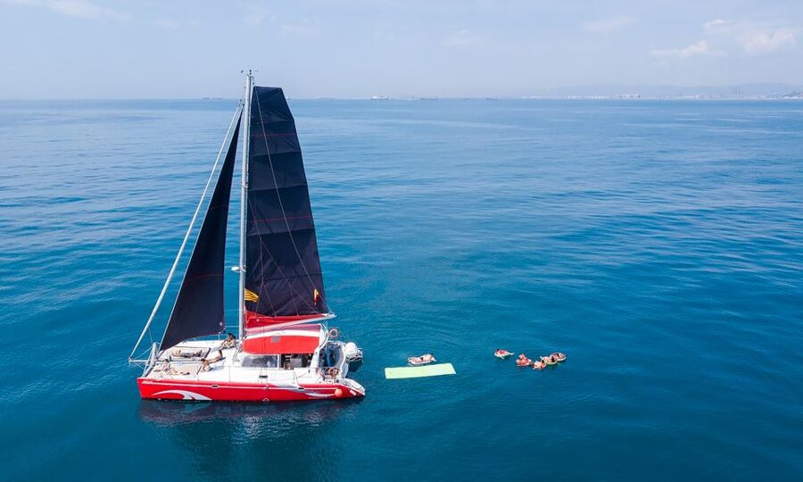 Barcelona: Sunset or Day Catamaran Cruise with Tapa & Drink - Marina Vela Check In, Right Next to Barceloneta