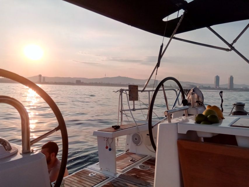 Barcelona: Sunset Sailing Tour with Open Bar & Snacks - The real payoff: sunset behind the mountains