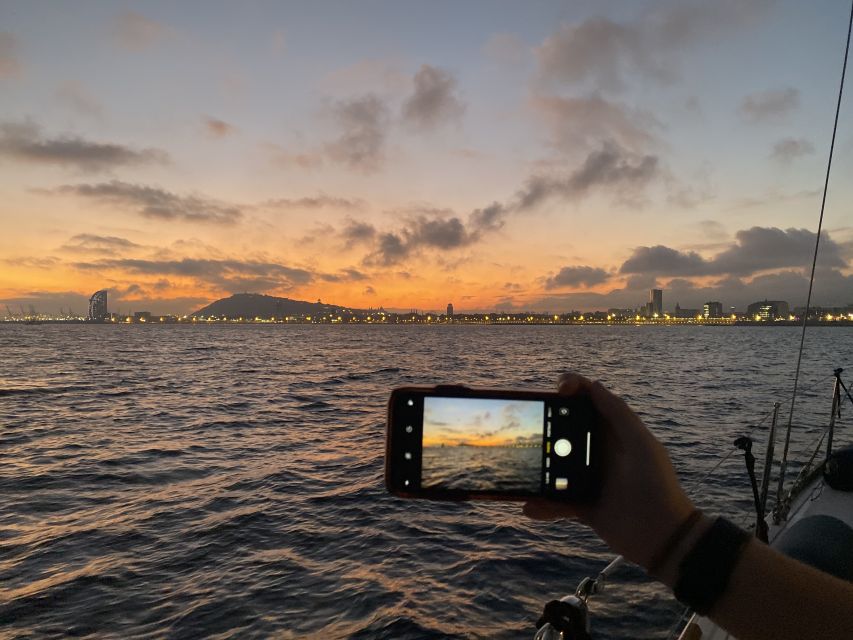 Barcelona: Sunset Sailing Tour with Open Bar & Snacks - Port Vell visit: a short pause with city energy