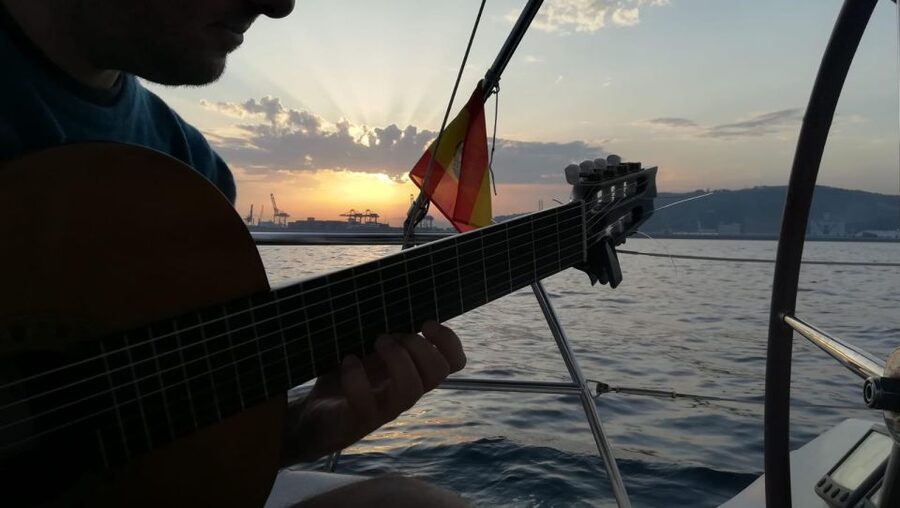 Barcelona: Sunset Sailing with Live Guitar Music and Tapas - Sunset Views and the Swim Stop: The Moment You Will Remember