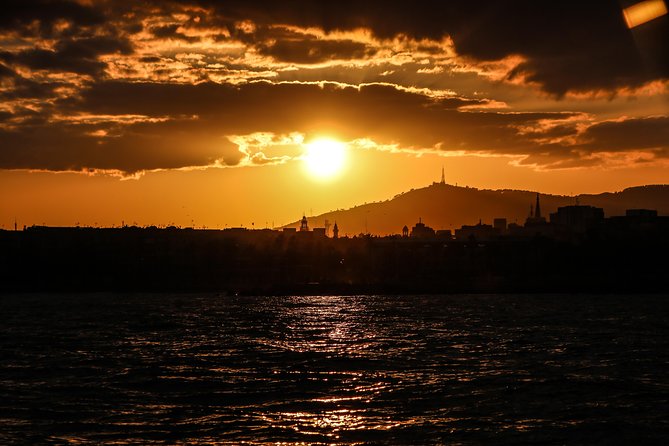 Barcelona Unique Sunset Sailing Experience with Tapas & Open Bar - Stop 2: cruising by Platja de la Nova Icaria