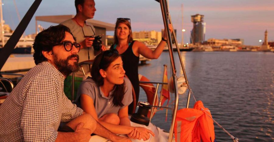 Barcelona: Unique Sunset Sailing Tour with Tapas & Open Bar - Steering the boat, skipper stories, and that calm onboard feeling