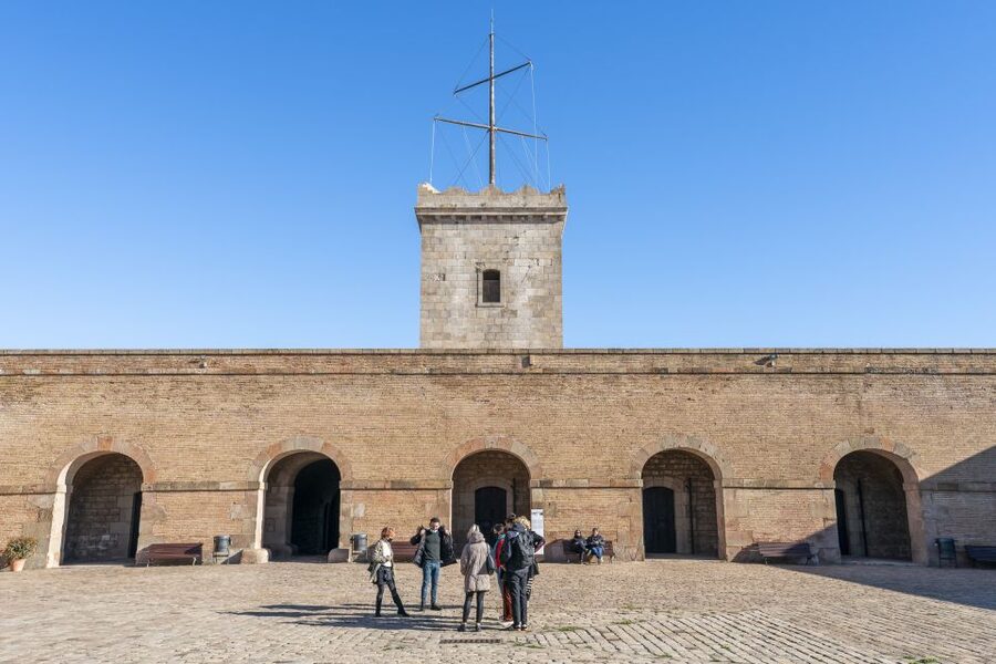 Barcelona: Walking tour with Montjuic Castle & Cable Car - Montjuïc Castle Inside: Dungeons, Tower Views, and the Military Fort Feel