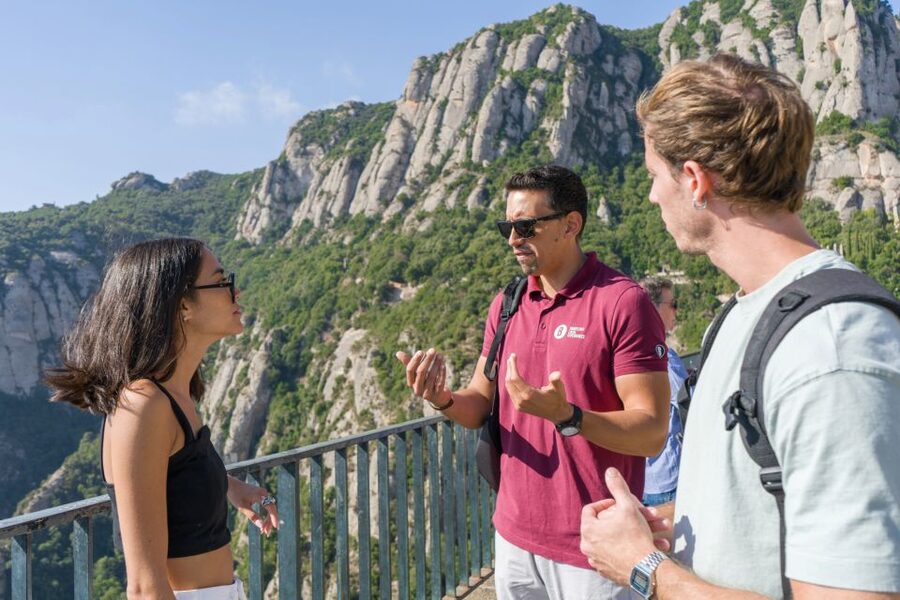 From Barcelona: Half-Day Montserrat Small Group Guided Tour - Sant Joan Funicular, the cross, and the question of time
