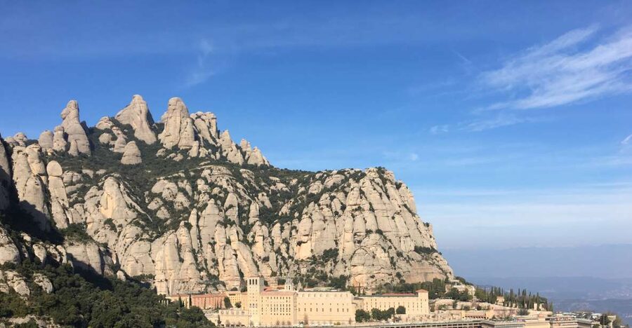 From Barcelona: Montserrat Mountain Hike and Abbey Tour - The Benedictine Monastery Stop: La Moreneta and Laid-Back Market Time