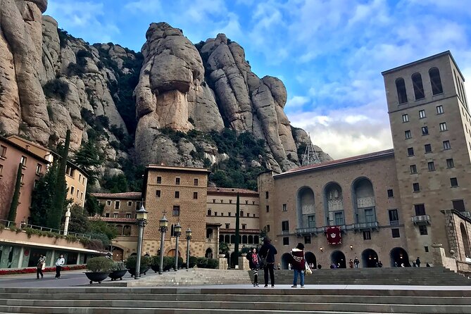 Montserrat Day Trip from Barcelona with Cogwheel Train - Stop 2: Santa Maria de Montserrat Abbey, faith and culture side by side