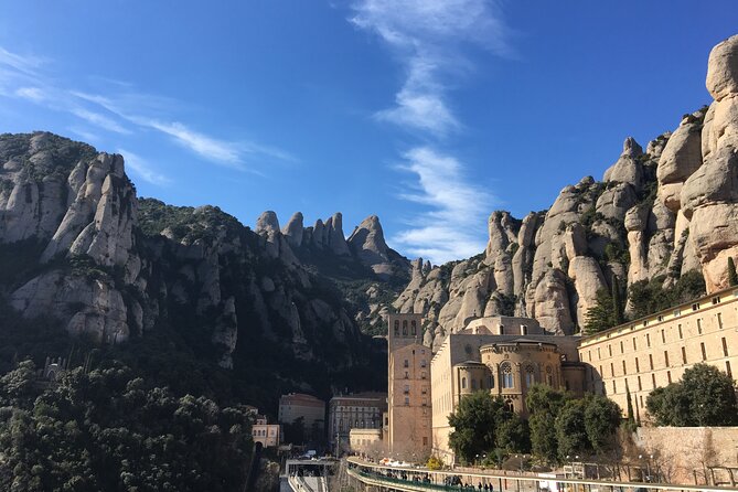Montserrat Land of Shrines - One Day Small Group Hiking Tour from Barcelona - Santa Maria de Montserrat and the Black Madonna stop
