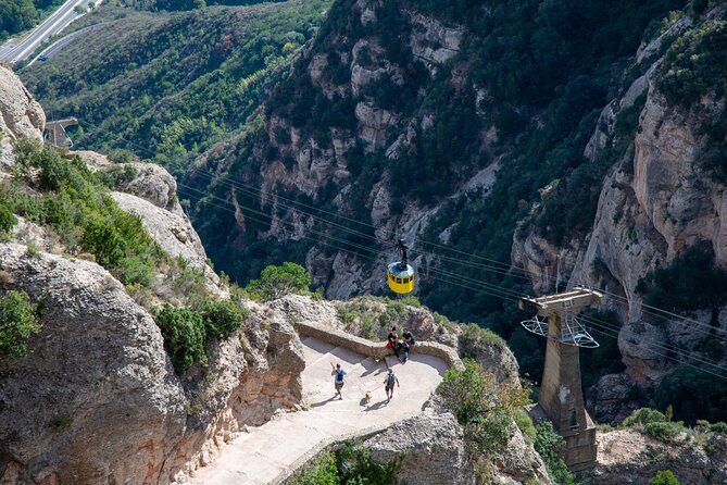 Montserrat Tour with Cogwheel Train, Monastery & Black Madonna - Santa Maria de Montserrat Abbey time and the included audio-visual stop