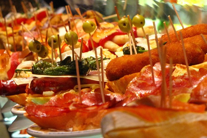 Private Tapas Walking Tour in Barcelona Modernist Area with Dinner included - Stop 2: The pintxos bar and the locals’ mix of fish, meat, and vegetables